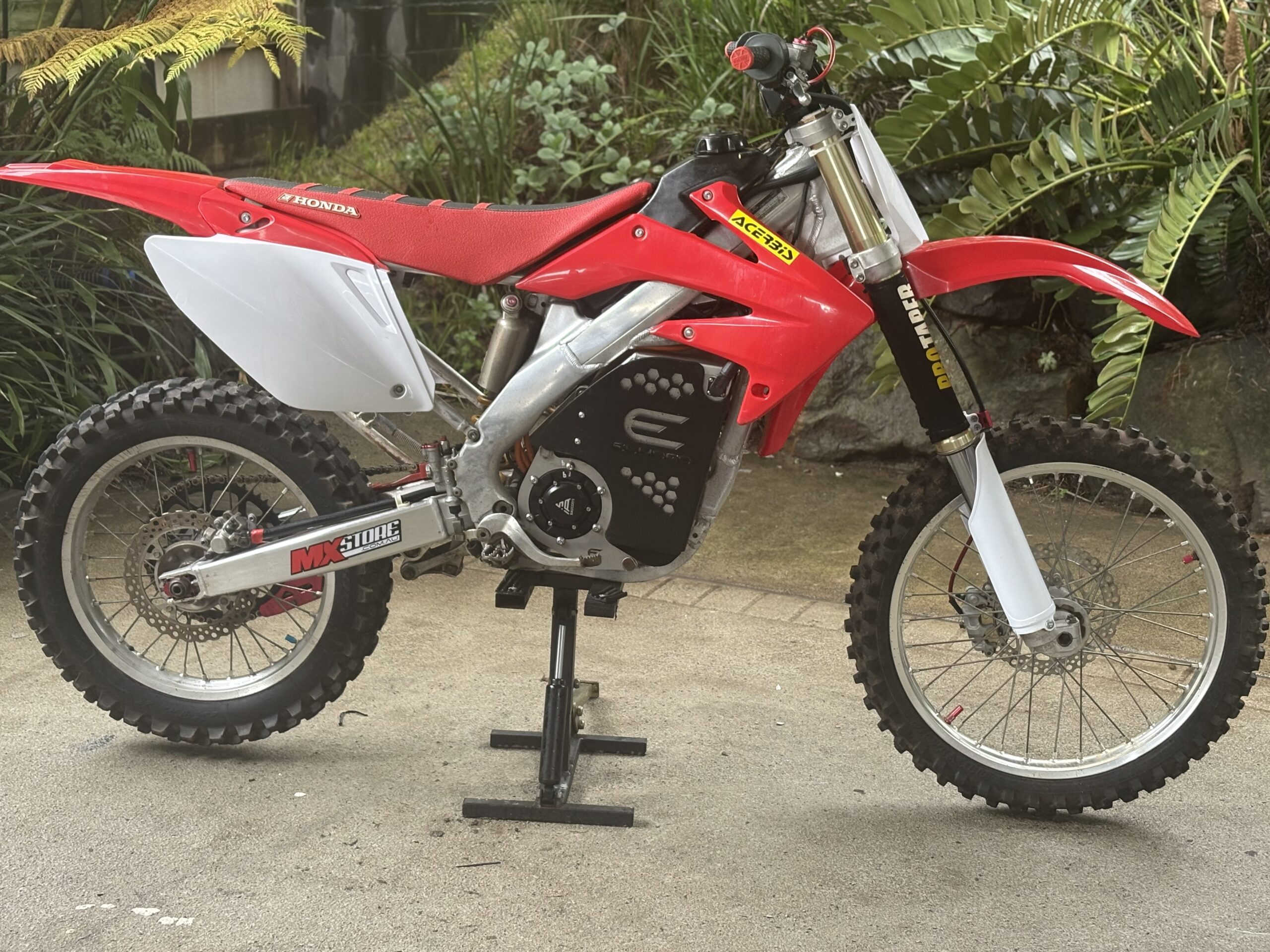 Red Honda CRF converted to electric by Fast E